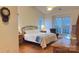 Main bedroom with hardwood floors and large windows at 12111 Frogs Leap Ct, Charlotte, NC 28277