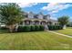 Two-story house with wrap-around porch, stone accents, and manicured lawn at 1265 Maddy Ln, Rock Hill, SC 29732