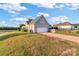 Attached garage with driveway and landscaped yard at 1265 Maddy Ln, Rock Hill, SC 29732