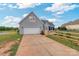 Two-car garage with driveway and fenced backyard at 1265 Maddy Ln, Rock Hill, SC 29732