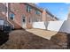 Small, fenced backyard with patio area at 135 Singleton Rd, Mooresville, NC 28117