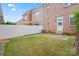 Backyard with a white fence, well-manicured lawn, and partial shade at 135 Singleton Rd, Mooresville, NC 28117