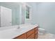 Bathroom features a light wooden vanity with a white countertop and a large mirror at 135 Singleton Rd, Mooresville, NC 28117