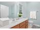 Clean bathroom with wooden vanity, white countertop, and fresh towels at 135 Singleton Rd, Mooresville, NC 28117