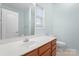 Bathroom featuring wood cabinets and vanity with a white countertop at 135 Singleton Rd, Mooresville, NC 28117