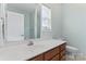 Bathroom with sink, toilet, and mirror at 135 Singleton Rd, Mooresville, NC 28117