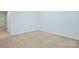 Bright bedroom featuring neutral carpet and pale blue walls, ready for personalization and comfort at 135 Singleton Rd, Mooresville, NC 28117
