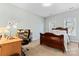 Bedroom with a wooden bed frame, desk, and chair at 135 Singleton Rd, Mooresville, NC 28117