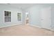 Spacious carpeted bedroom with light blue walls and natural light at 135 Singleton Rd, Mooresville, NC 28117