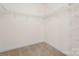 Walk-in closet with carpeted floors and wire shelving at 135 Singleton Rd, Mooresville, NC 28117