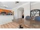 Kitchen with breakfast bar, dining table and chairs, and hardwood floors at 135 Singleton Rd, Mooresville, NC 28117