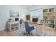 Functional home office with dual desks, bookshelves, and natural light at 135 Singleton Rd, Mooresville, NC 28117