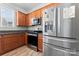 Modern kitchen with stainless steel appliances and wood cabinets at 135 Singleton Rd, Mooresville, NC 28117