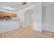 Inviting kitchen with wood cabinets, granite countertops, and stylish light-wood flooring at 135 Singleton Rd, Mooresville, NC 28117