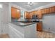 Modern kitchen featuring wood cabinets, granite countertops, and stainless steel microwave at 135 Singleton Rd, Mooresville, NC 28117
