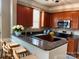 Well-equipped kitchen featuring stainless steel appliances and a breakfast bar with seating at 135 Singleton Rd, Mooresville, NC 28117