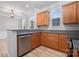 Bright kitchen features wood cabinets, granite countertops, and stainless steel dishwasher at 135 Singleton Rd, Mooresville, NC 28117