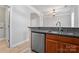 Kitchen features a stainless steel dishwasher, granite countertops and wood cabinets at 135 Singleton Rd, Mooresville, NC 28117