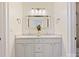 Double vanity bathroom with white cabinets and a large mirror at 13713 Batemans Rd, Huntersville, NC 28078