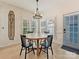 Bright dining area features a charming wooden table with four chairs, and an accent wall at 13713 Batemans Rd, Huntersville, NC 28078