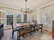 Elegant dining room with a rustic farmhouse table and bench seating at 13713 Batemans Rd, Huntersville, NC 28078