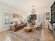 Bright home office with built-in shelving and hardwood floors at 13713 Batemans Rd, Huntersville, NC 28078