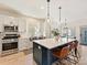 Modern kitchen with large island and white cabinetry at 13713 Batemans Rd, Huntersville, NC 28078