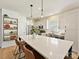 Modern kitchen with large island and white cabinetry at 13713 Batemans Rd, Huntersville, NC 28078