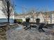 Cozy patio with fire pit and seating area, perfect for outdoor entertaining at 13713 Batemans Rd, Huntersville, NC 28078