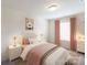 Bedroom with a queen bed and soft pink color scheme at 14123 Penbury Ln # 360, Charlotte, NC 28278