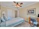 Bright bedroom with a ceiling fan, a study desk, and natural light streaming through the windows at 153 Snead Rd # 72, Fort Mill, SC 29715