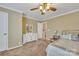 Comfortable bedroom with natural light, featuring a mirrored dresser and a ceiling fan at 153 Snead Rd # 72, Fort Mill, SC 29715