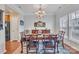 Elegant dining room featuring a chandelier, a dining table with chairs and hardwood floors at 153 Snead Rd # 72, Fort Mill, SC 29715