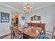 Formal dining room featuring classic wood table, chairs, and elegant chandelier at 153 Snead Rd # 72, Fort Mill, SC 29715