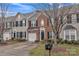 Charming brick and siding townhome with attached garage, black shutters, and manicured landscaping at 153 Snead Rd # 72, Fort Mill, SC 29715