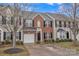 Brick and siding townhome with a black front door, attached garage, and well-maintained front yard at 153 Snead Rd # 72, Fort Mill, SC 29715