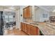 Kitchen featuring wood cabinets, granite countertops, stainless steel sink and hardwood floors at 153 Snead Rd # 72, Fort Mill, SC 29715