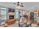 Inviting living room featuring a stone fireplace, wood floors, and ample natural light at 153 Snead Rd # 72, Fort Mill, SC 29715