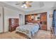 Spacious main bedroom featuring a ceiling fan, tray ceiling, and custom built-in wardrobe at 153 Snead Rd # 72, Fort Mill, SC 29715