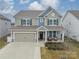 Two-story house with a neutral color palette and a two-car garage at 172 Longleaf Dr, Mooresville, NC 28117