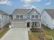 Two-story house with attached garage and landscaping at 172 Longleaf Dr, Mooresville, NC 28117