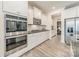 Modern kitchen with stainless steel appliances and white cabinets at 172 Longleaf Dr, Mooresville, NC 28117