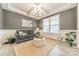 Cozy living room featuring a gray sofa and a neutral color scheme at 172 Longleaf Dr, Mooresville, NC 28117