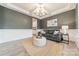 Cozy living room featuring a gray sofa and a neutral color scheme at 172 Longleaf Dr, Mooresville, NC 28117