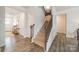 Elegant staircase with a modern iron railing at 172 Longleaf Dr, Mooresville, NC 28117