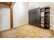 Bedroom with built-in shelving and wardrobe at 201 S Hoskins Rd # 313, Charlotte, NC 28208