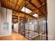 Interior hallway with exposed wood beams and skylights at 201 S Hoskins Rd # 313, Charlotte, NC 28208