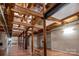 Long hallway showcasing exposed beams and wood flooring at 201 S Hoskins Rd # 313, Charlotte, NC 28208