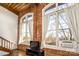 Living area showcasing exposed brick and wood beams at 201 S Hoskins Rd # 313, Charlotte, NC 28208