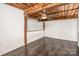 Loft bedroom with exposed beams and ceiling fan at 201 S Hoskins Rd # 313, Charlotte, NC 28208